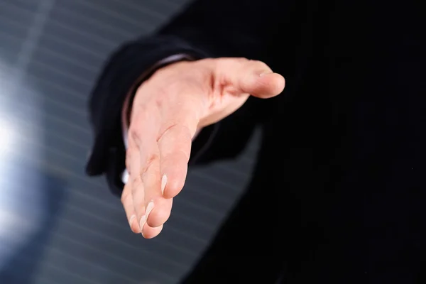 Businessman extending hand to shake — Stock Photo, Image