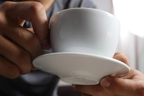 Cup of coffee in hands — Stock Photo, Image