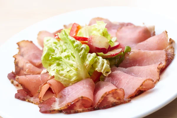 Meat appetizer on plate — Stock Photo, Image