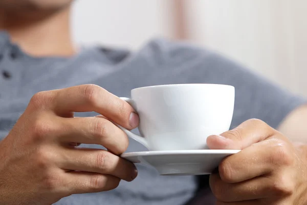 Cup of coffee in hands — Stock Photo, Image