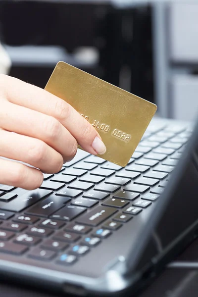 Woman holding credit card Stock Picture