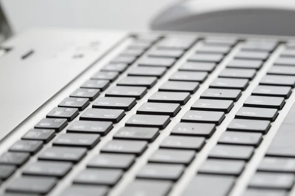 Laptop keyboard with mouse — Stock Photo, Image