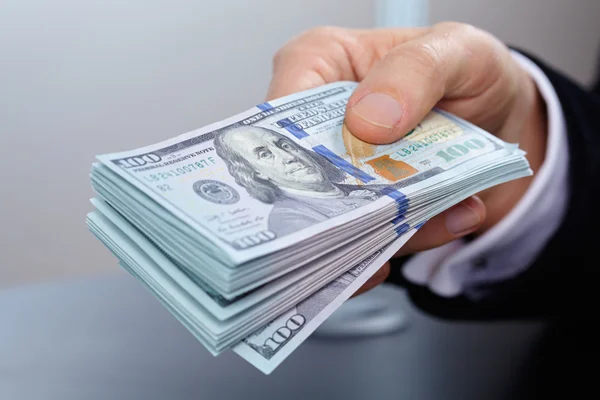 Businessman holding banknotes — Stock Photo, Image