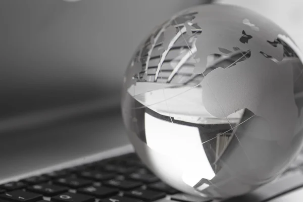 Earth globe on keyboard — Stock Photo, Image