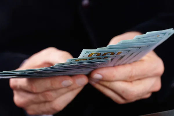 Businessman holding banknotes — Stock Photo, Image