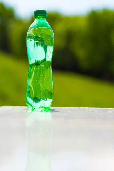 bottle of water in grass