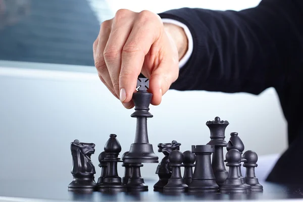 Businessman playing chess — Stock Photo, Image