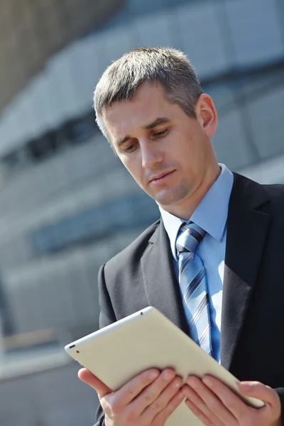 Businessman using a tablet Royalty Free Stock Photos