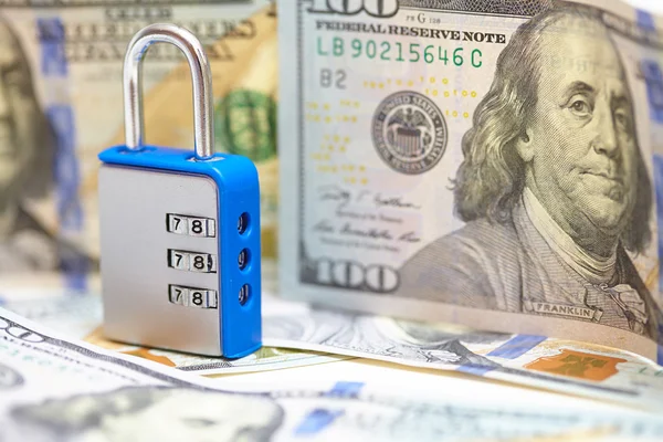 Padlock on dollar banknotes — Stock Photo, Image