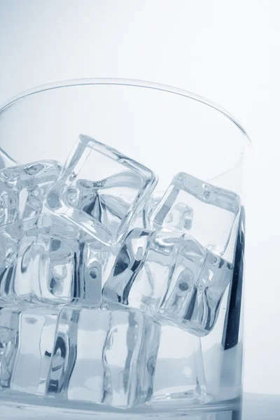 Glass with ice cubes — Stock Photo, Image