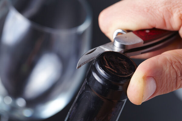 Man opening wine