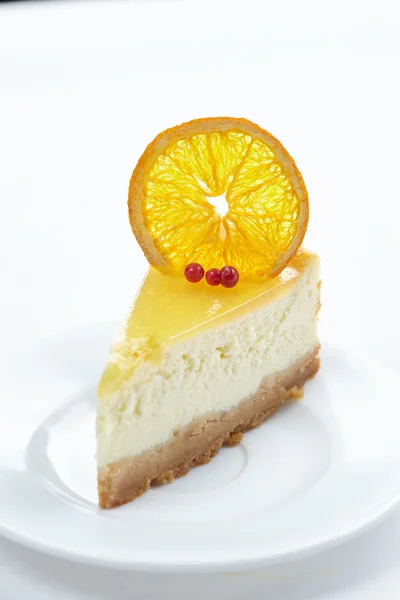 Cheesecake with orange on white — Stock Photo, Image