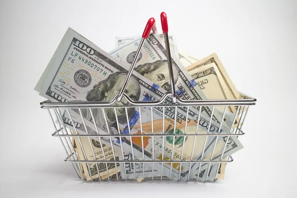 Shopping basket full of money — Stock Photo, Image