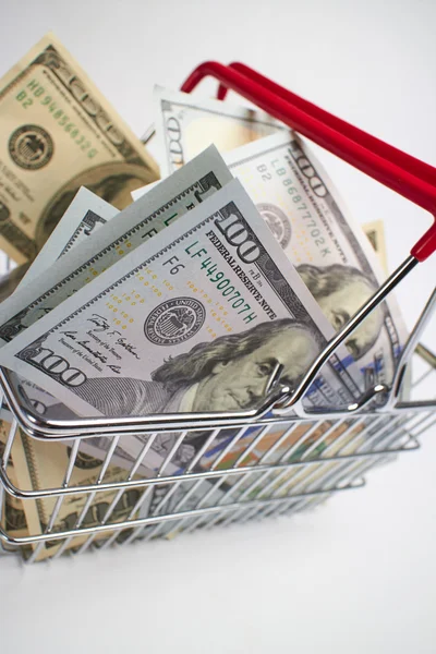 Shopping basket full of money — Stock Photo, Image