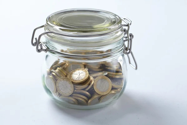 Closed jar with coins — Stock Photo, Image