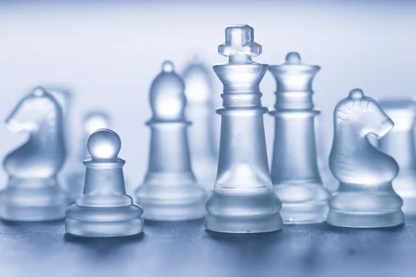 Glass chess on grey — Stock Photo, Image