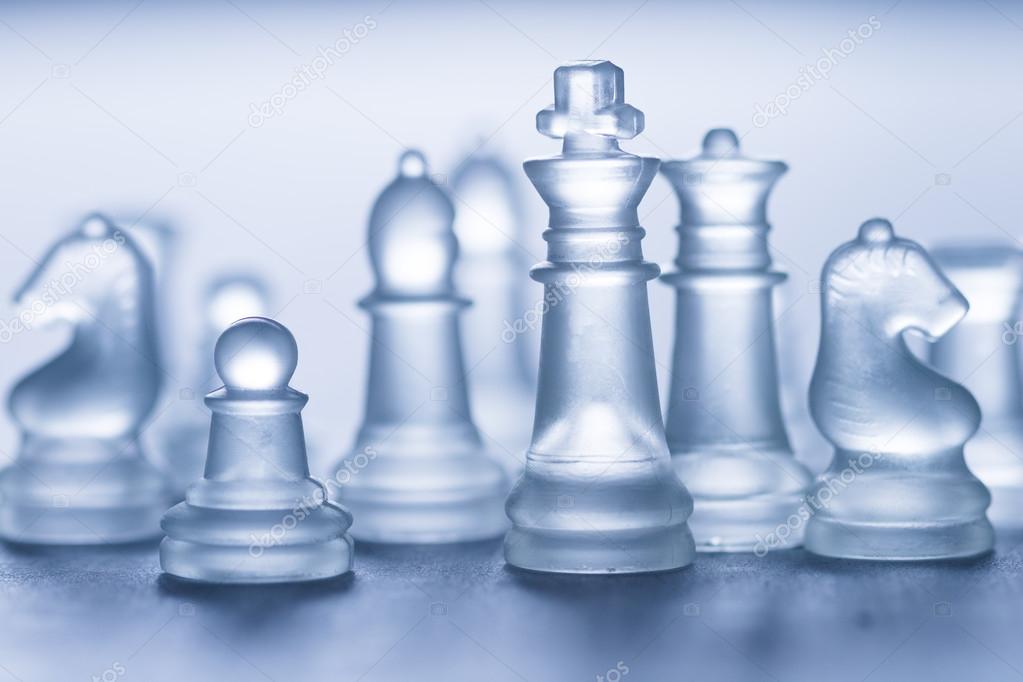 glass chess on grey