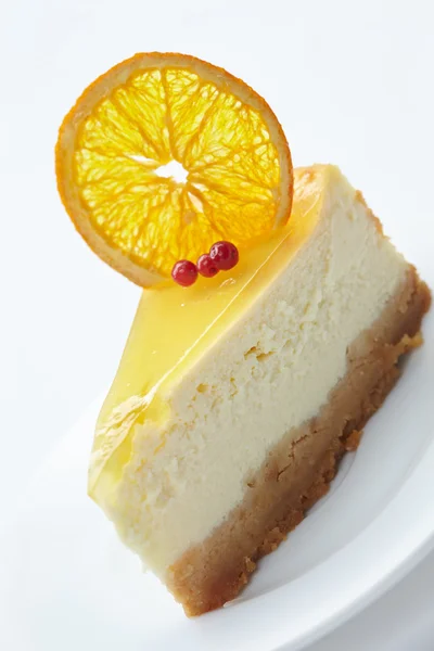 Cheesecake with orange on white — Stock Photo, Image