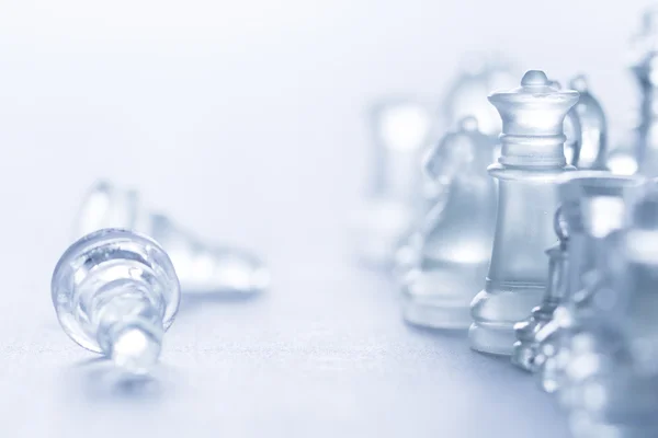 Glass chess on blue — Stock Photo, Image
