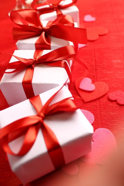 Gifts with red ribbons — Stock Photo, Image