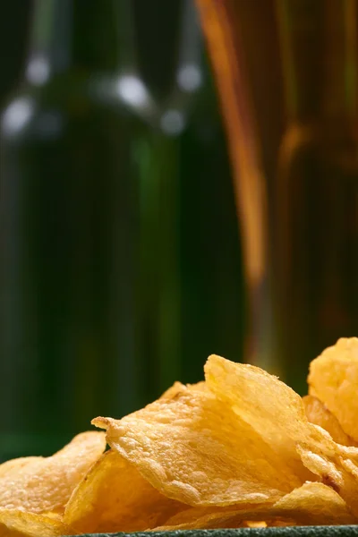 Potato chips and beer — Stock Photo, Image