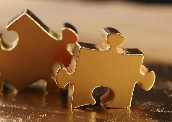 Golden puzzles background — Stock Photo, Image