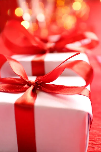 Gift boxes with red ribbons Royalty Free Stock Images