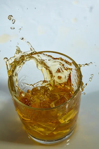 Whiskey with ice cubes in glass — Stock Photo, Image