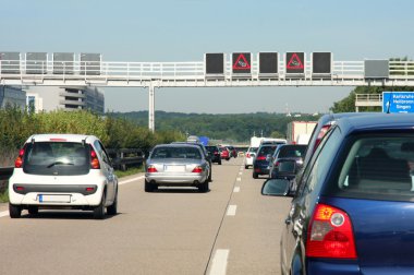 cars in traffic jam on highway, in Germany  clipart