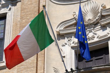 Flags of Italy and European Union waving in Rome, Italy