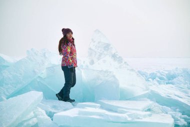 Traveller in a ski suit in Surreal Ice Landscape, Kazakhstan clipart