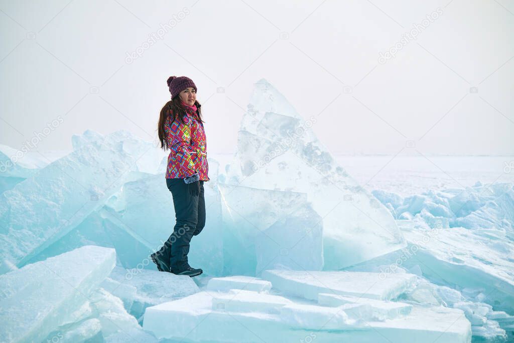 Traveller in a ski suit in Surreal Ice Landscape, Kazakhstan