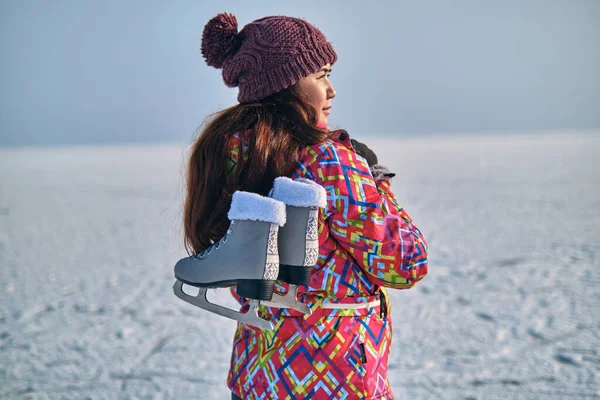 Woman Ski Suit Holds Skates Her Shoulder Looks Distance Skiing — Stock Photo, Image