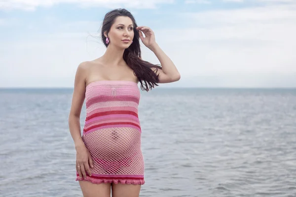 Pregnant woman in white swimsuit — Stock Photo, Image