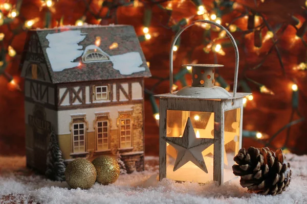 Lantern and christmas lights burning in dark — Stock Photo, Image