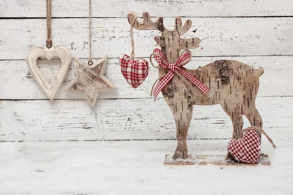 Renna di Natale su sfondo di legno in stile scandinavo — Foto Stock