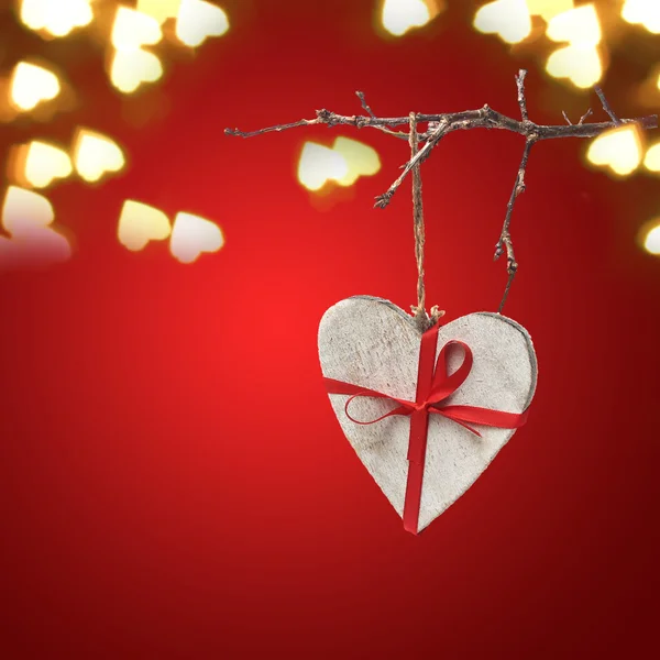 Wooden heart on red valentine background — Stock Photo, Image