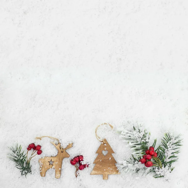 Christmas background with wooden reindeer — Stock Photo, Image