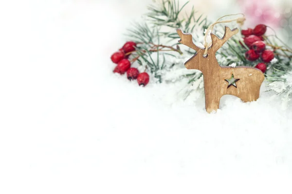 Різдвяний фон з дерев'яними оленями — стокове фото