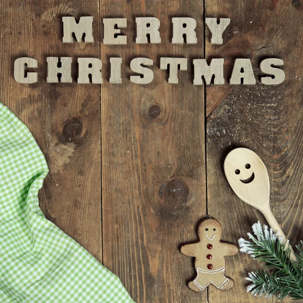 Texto Feliz Natal no fundo de madeira velho — Fotografia de Stock