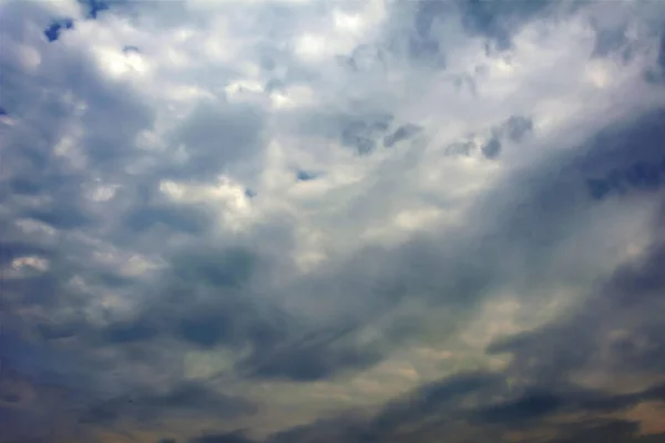 Golden Clouds Dark Storm Clouds Blue Sky Background — Stock Photo, Image