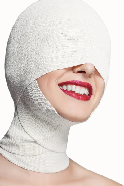 Beautiful girl with a bandaged face. Smile Stock Picture