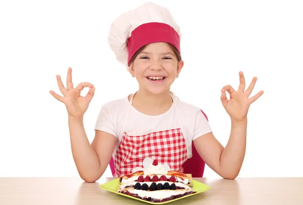 Happy little girl cook with crepes and ok hand signs — Stock Photo, Image