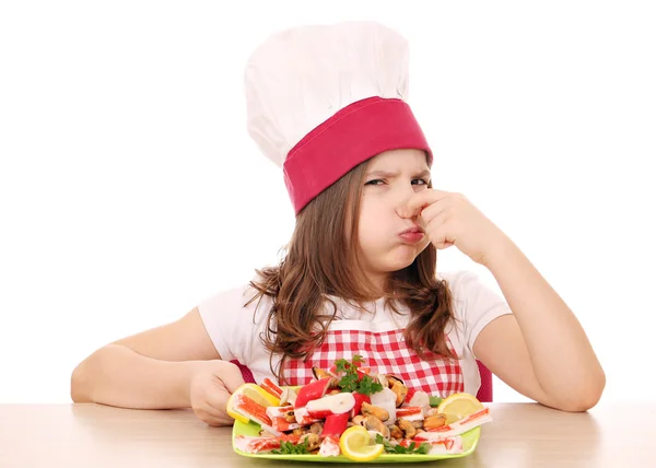 Little girl cook with seafood bad smell — Stock Photo, Image