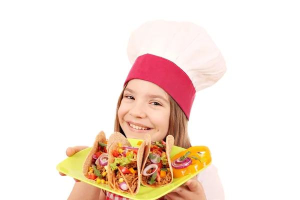 Heureuse petite fille cuisinier avec tacos restauration rapide — Photo