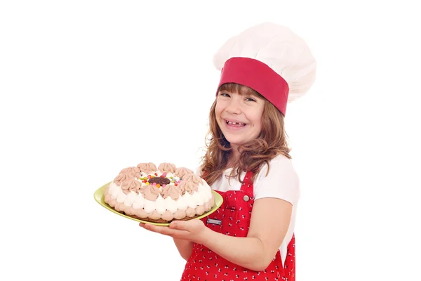 Feliz niña cocinero con dulce pastel — Foto de Stock