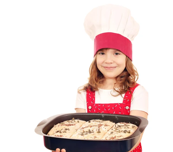 Happy little girl cook hold plate with bread — Stock Photo, Image