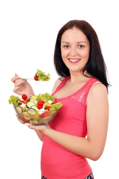 Menina adolescente feliz comer salada — Fotografia de Stock