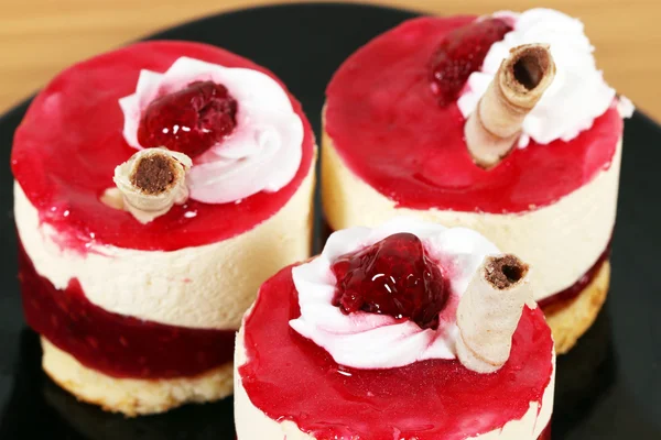 Three sweet raspberry cakes closeup — Stock Photo, Image