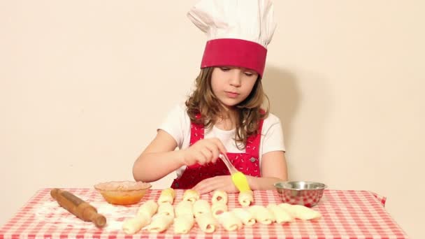 Beautiful little girl cook make rolls — Stockvideo
